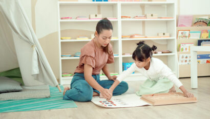 Child and teacher do an activity